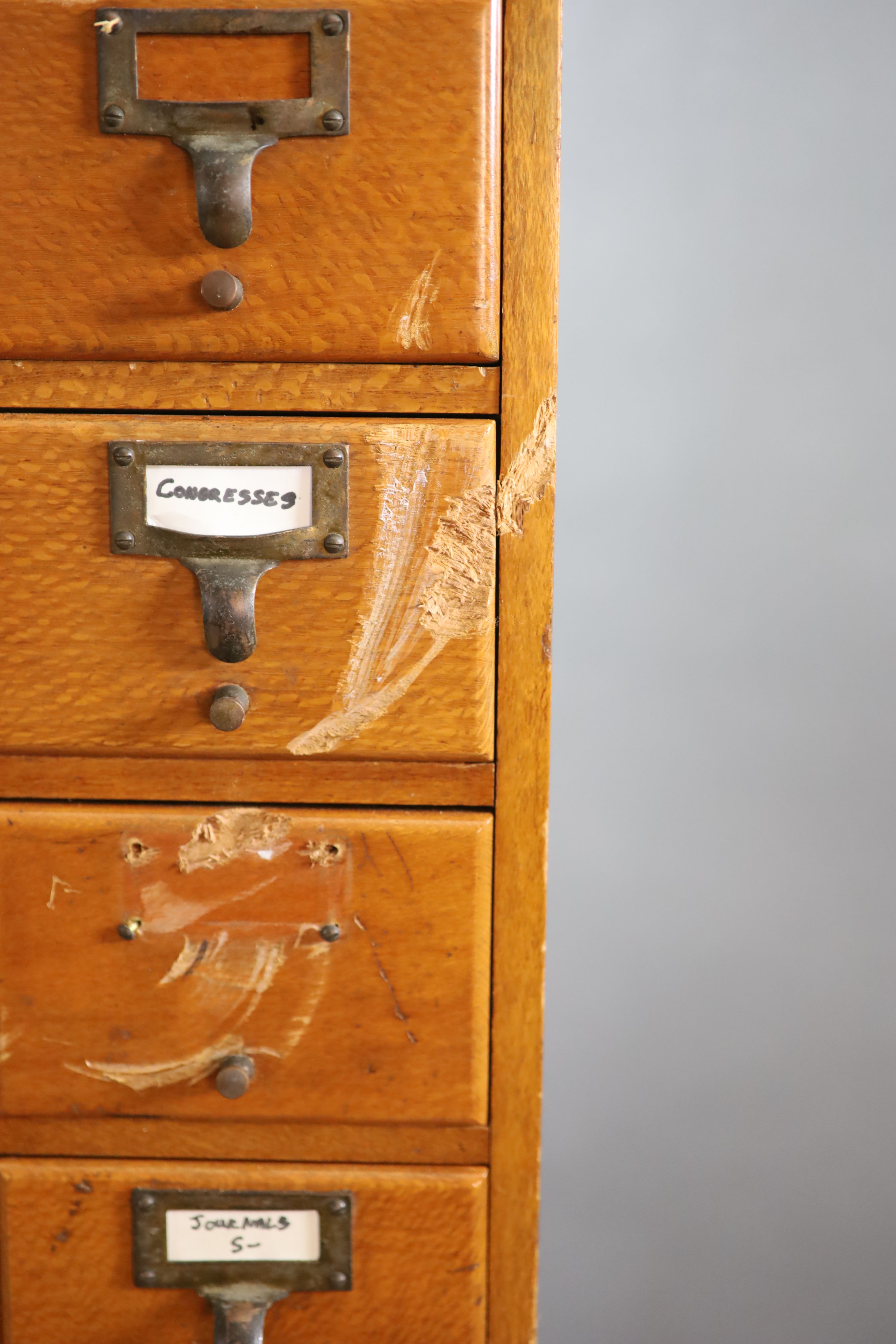 An early 20th century golden oak filing chest on stand, fitted twelve drawers, width 50cm depth 41cm height 131cm